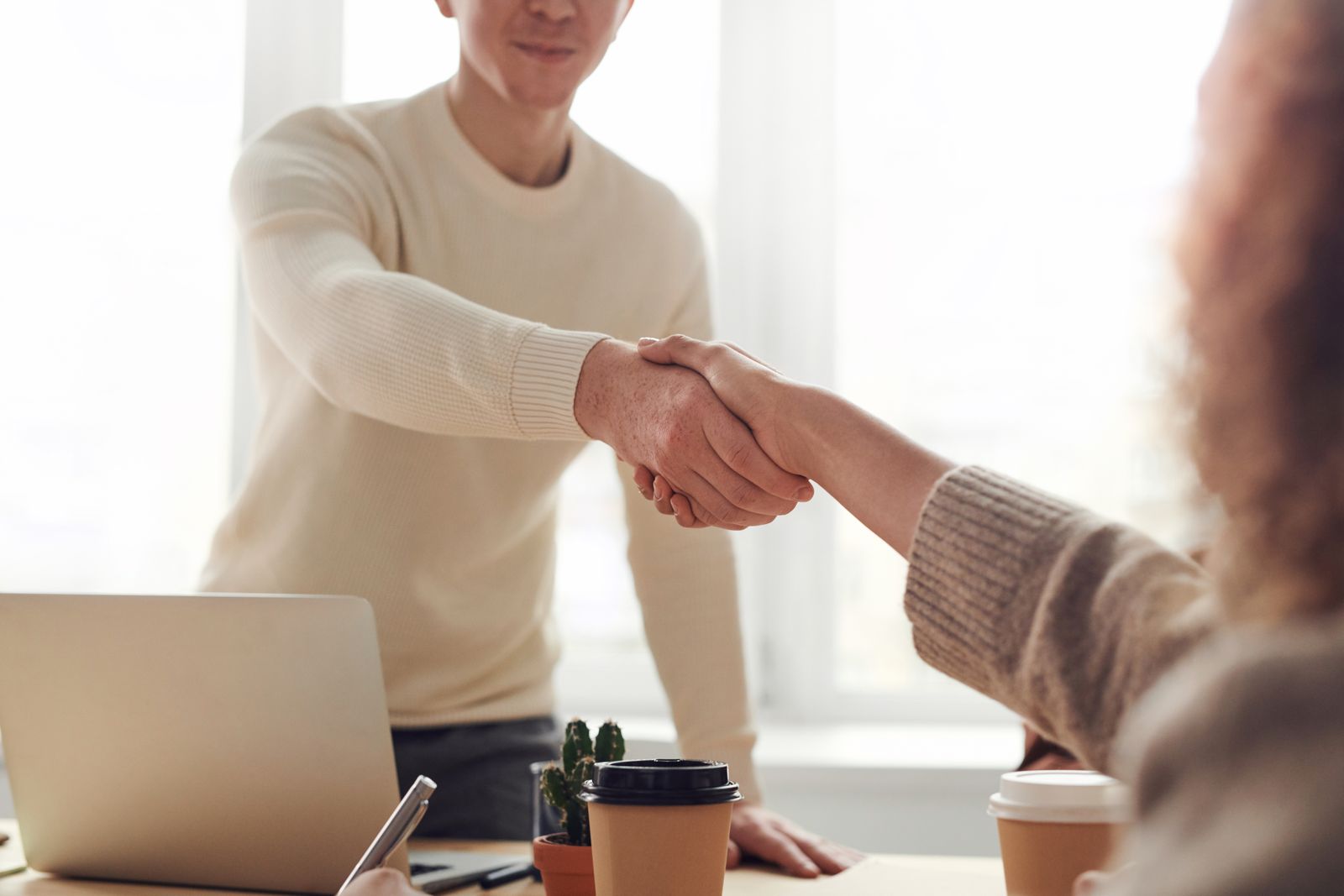Corporate professionals in a meeting discussing personnel support.