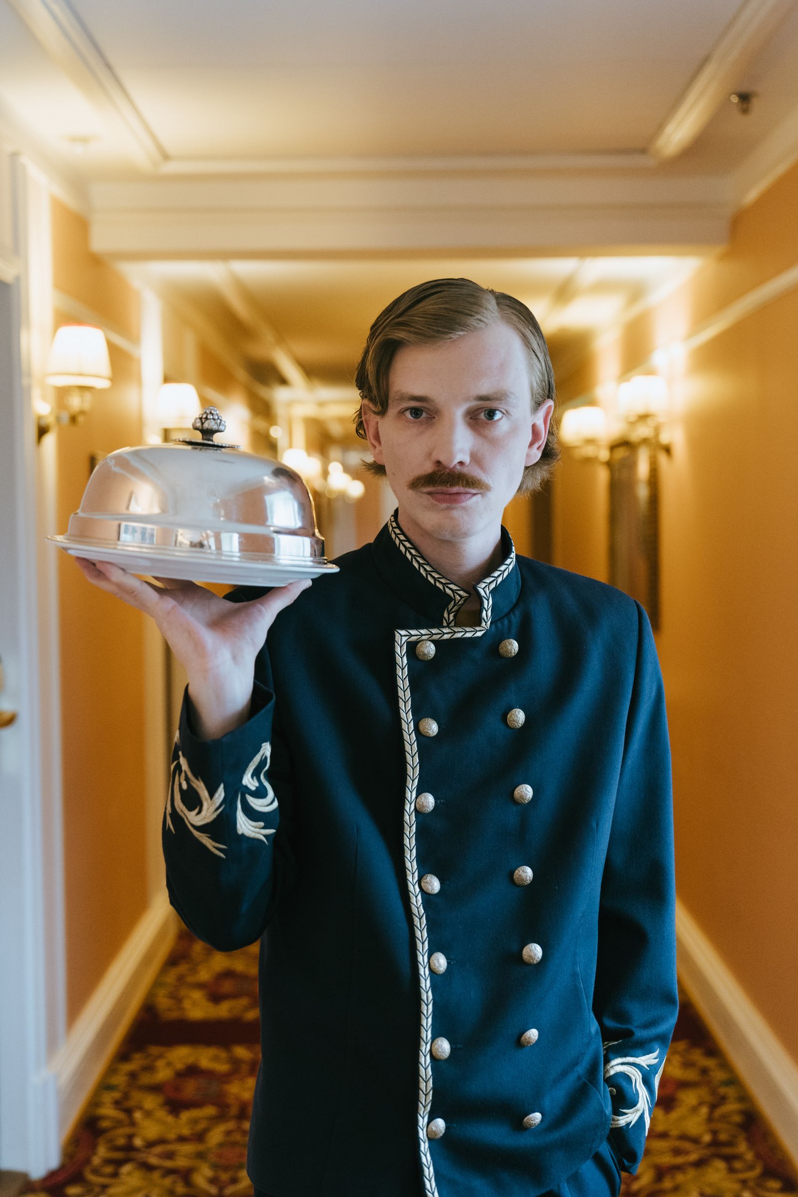 Hospitality staff in a hotel setting.