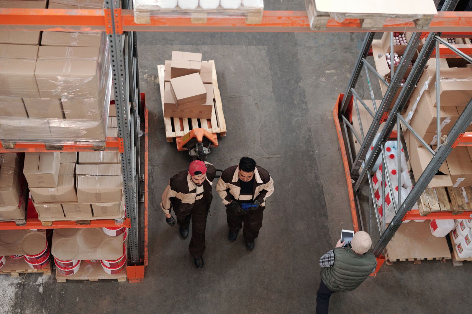 Warehouse team scanning boxes and managing inventory.